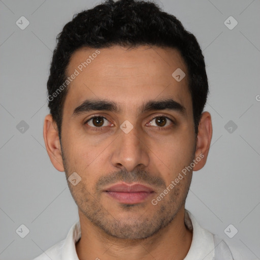 Neutral latino young-adult male with short  black hair and brown eyes