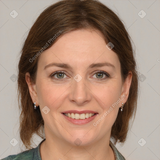 Joyful white adult female with medium  brown hair and grey eyes