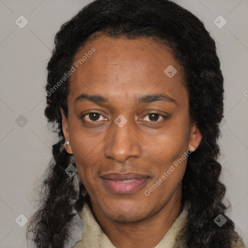 Joyful black adult female with long  black hair and brown eyes