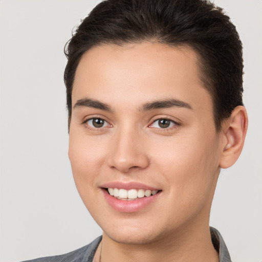 Joyful white young-adult female with short  brown hair and brown eyes