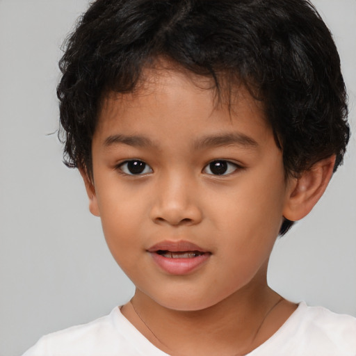 Joyful latino child female with short  brown hair and brown eyes