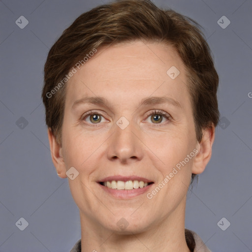 Joyful white adult female with short  brown hair and grey eyes