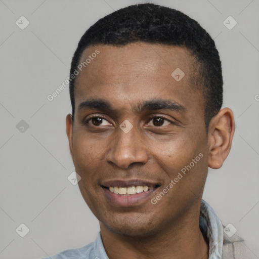 Joyful latino young-adult male with short  black hair and brown eyes