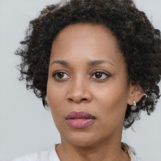Neutral black adult female with short  brown hair and brown eyes