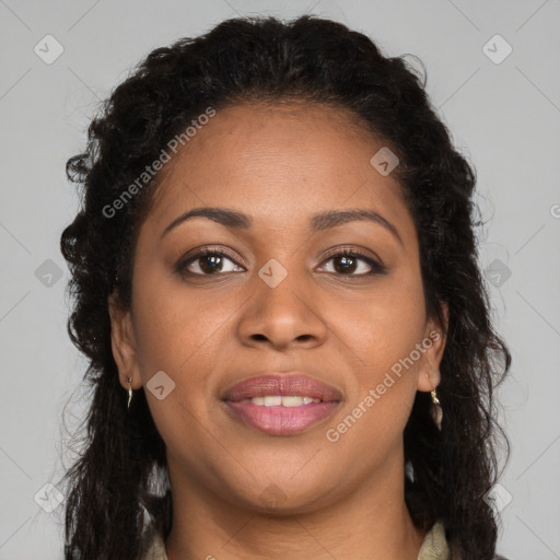 Joyful black young-adult female with long  brown hair and brown eyes