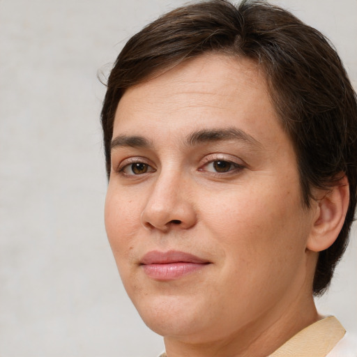 Joyful white young-adult female with medium  brown hair and brown eyes