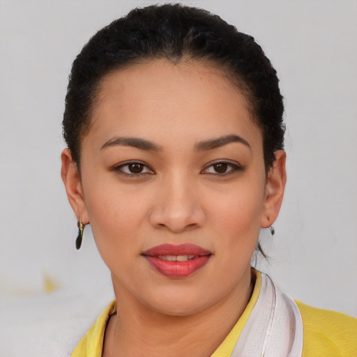 Joyful latino young-adult female with short  brown hair and brown eyes