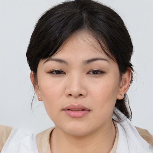 Neutral asian young-adult female with medium  brown hair and brown eyes