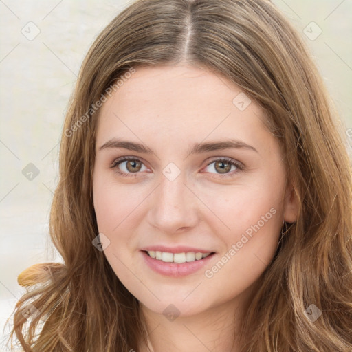 Joyful white young-adult female with long  brown hair and green eyes