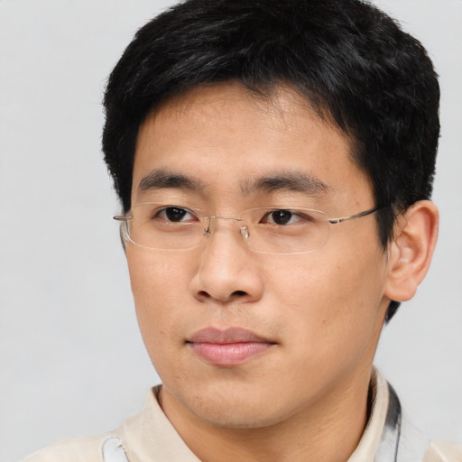 Neutral asian young-adult male with short  brown hair and brown eyes