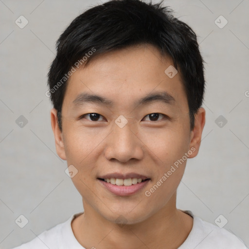 Joyful asian young-adult male with short  black hair and brown eyes