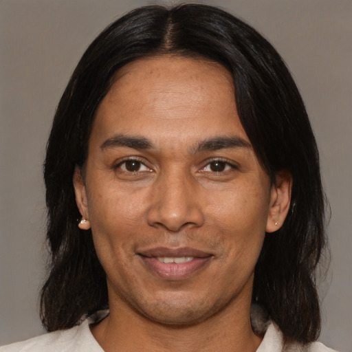 Joyful asian adult male with medium  black hair and brown eyes