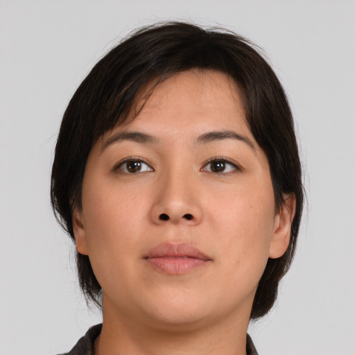 Neutral asian young-adult female with medium  brown hair and brown eyes