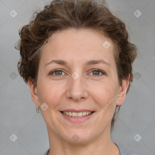 Joyful white adult female with short  brown hair and brown eyes