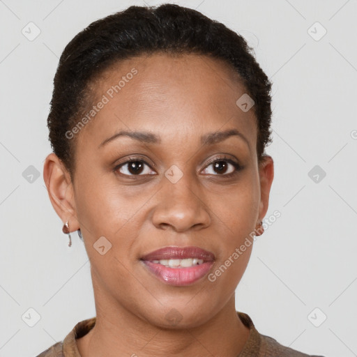 Joyful black young-adult female with short  brown hair and brown eyes