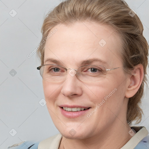 Joyful white adult female with medium  brown hair and blue eyes