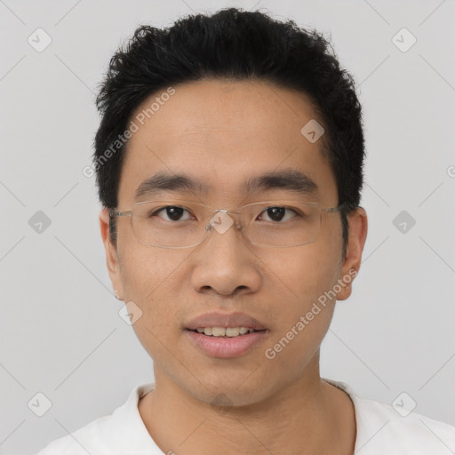 Joyful asian young-adult male with short  black hair and brown eyes