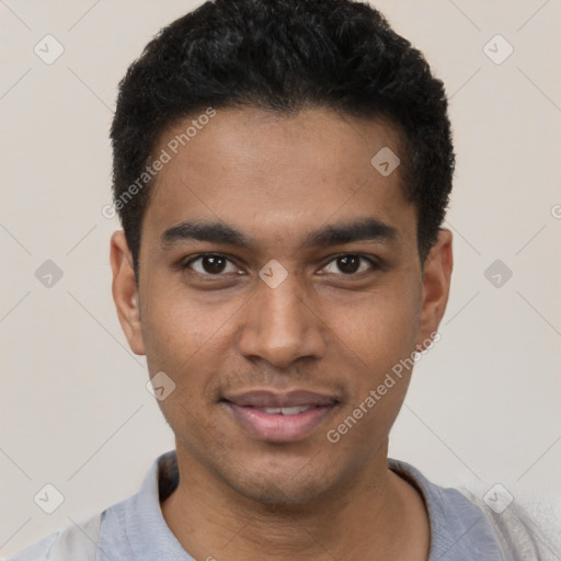 Joyful black young-adult male with short  black hair and brown eyes