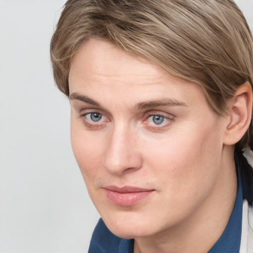 Joyful white young-adult female with medium  brown hair and blue eyes