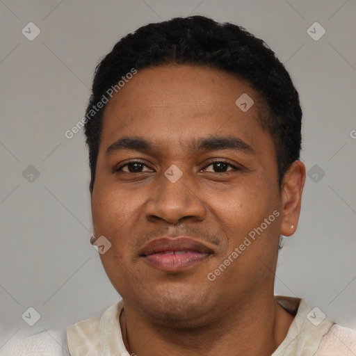 Joyful latino young-adult male with short  black hair and brown eyes