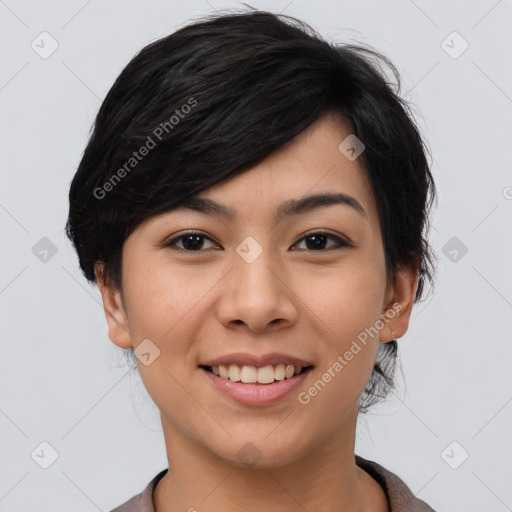 Joyful asian young-adult female with short  black hair and brown eyes