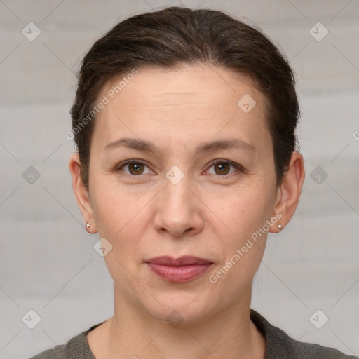 Joyful white adult female with short  brown hair and grey eyes