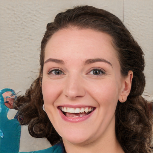 Joyful white young-adult female with medium  brown hair and green eyes