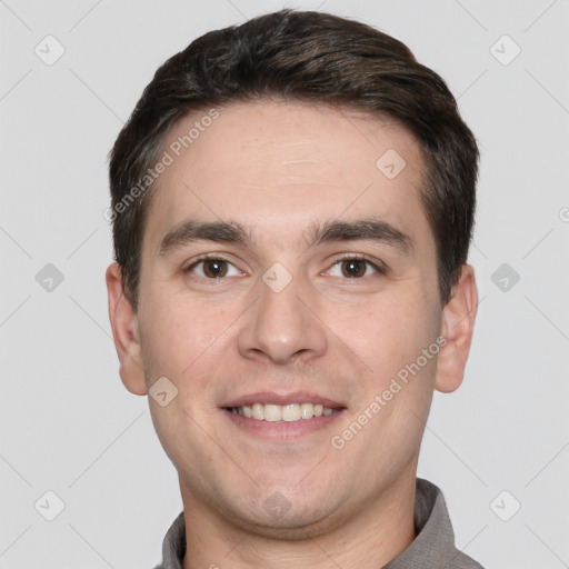 Joyful white young-adult male with short  black hair and brown eyes