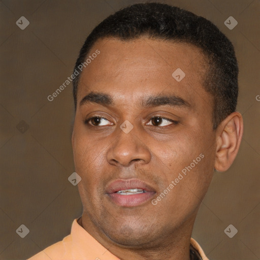 Joyful black young-adult male with short  brown hair and brown eyes