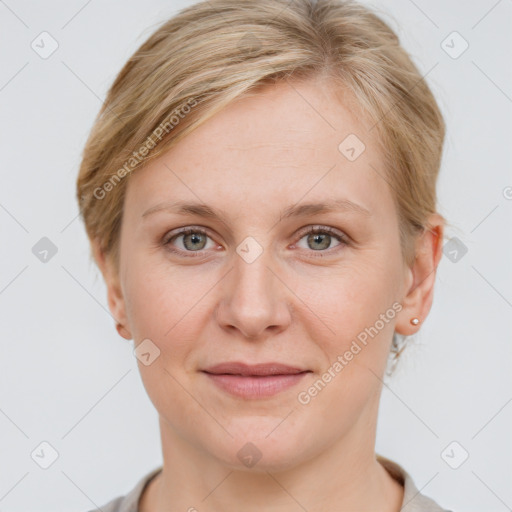 Joyful white young-adult female with short  brown hair and grey eyes