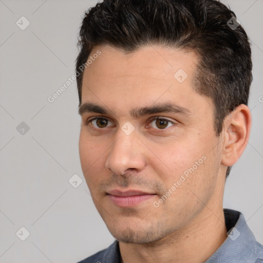 Joyful white young-adult male with short  brown hair and brown eyes