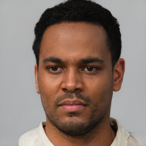 Neutral black young-adult male with short  black hair and brown eyes