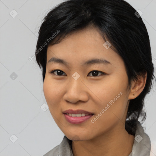 Joyful asian young-adult female with medium  black hair and brown eyes