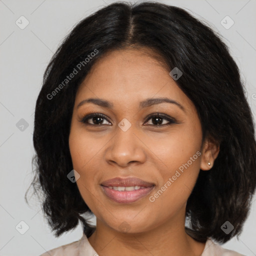 Joyful black young-adult female with medium  brown hair and brown eyes