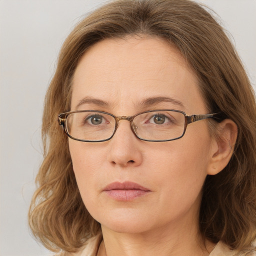 Neutral white young-adult female with long  brown hair and blue eyes