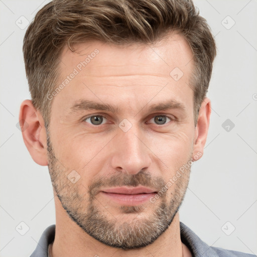 Joyful white adult male with short  brown hair and grey eyes