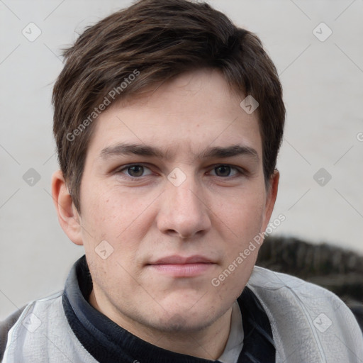 Neutral white young-adult male with short  brown hair and grey eyes