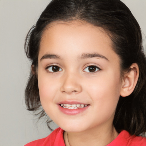 Joyful white child female with medium  brown hair and brown eyes