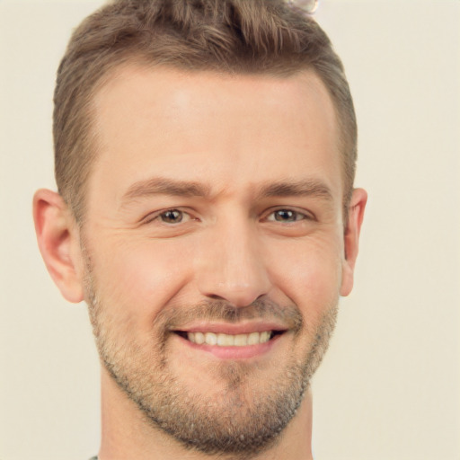 Joyful white adult male with short  brown hair and brown eyes