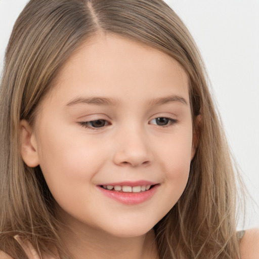 Joyful white child female with long  brown hair and brown eyes