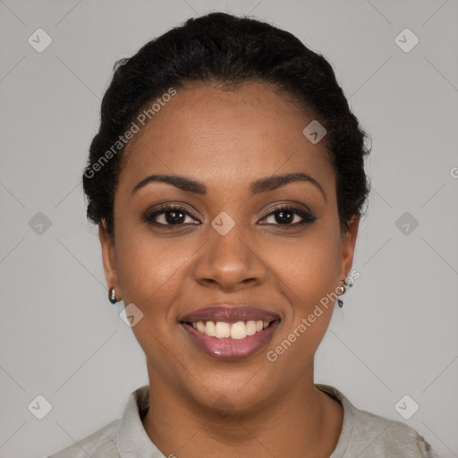 Joyful black young-adult female with short  black hair and brown eyes