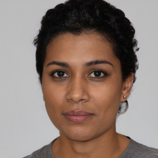 Neutral latino young-adult female with short  black hair and brown eyes
