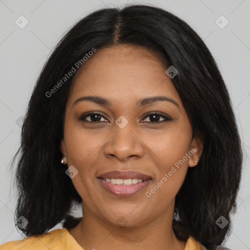 Joyful black young-adult female with long  black hair and brown eyes