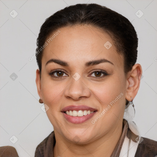 Joyful white young-adult female with short  brown hair and brown eyes