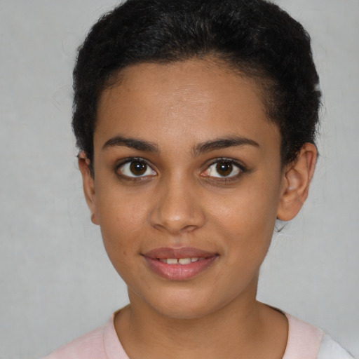 Joyful latino young-adult female with short  brown hair and brown eyes