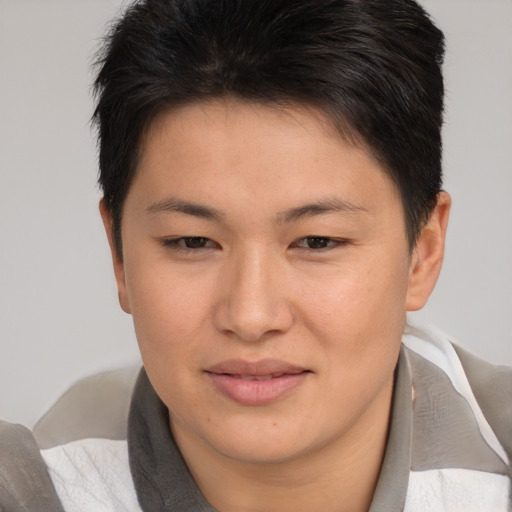 Joyful asian young-adult female with short  brown hair and brown eyes