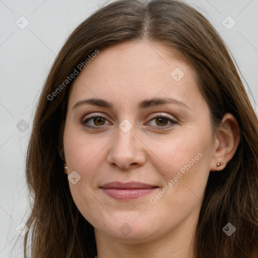 Joyful white young-adult female with long  brown hair and green eyes