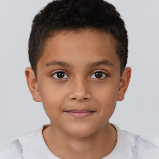 Joyful latino child male with short  brown hair and brown eyes