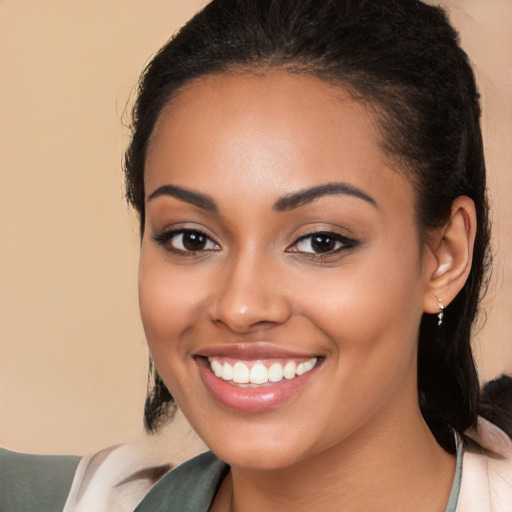 Joyful latino young-adult female with medium  brown hair and brown eyes