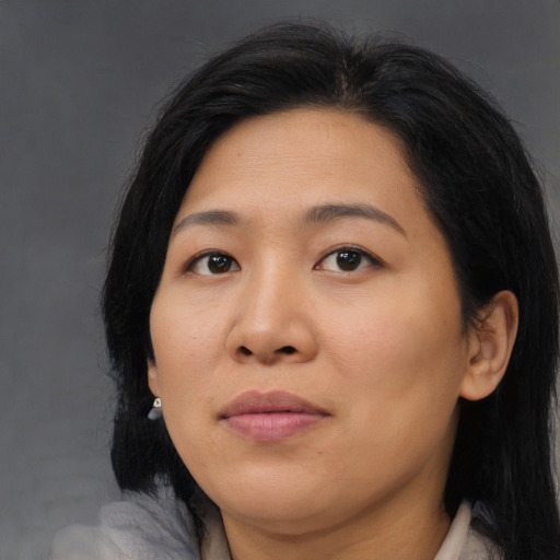 Joyful asian young-adult female with medium  brown hair and brown eyes